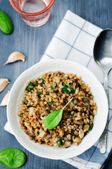 spinach, mushrooms buckwheat with spinach leaves