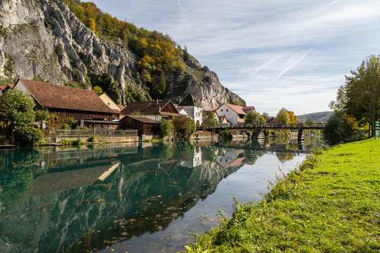 Idyllic view at the village Markt Essing in Bavaria, Germany with the Altmuehl river and high rocks