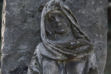 Obraz premium Monument and candles in the cemetery. All Saints Day in Poland.
