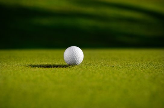Golf ball close to the hole