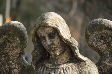 Monument and candles in the cemetery. All Saints Day in Poland.