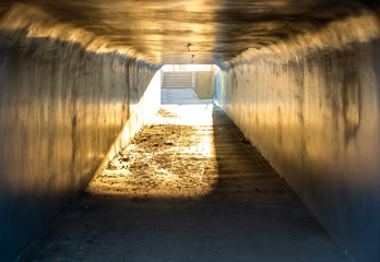 dirty with garbage underpass in the sun