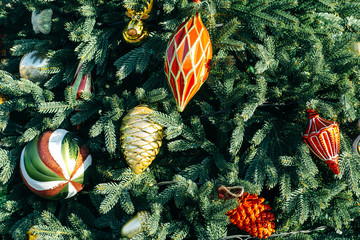 Obraz na płótnie Canvas Christmas toys on the branches of the Christmas tree, close up