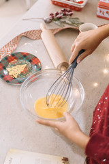 Top view of kitchen table with egg mixture into a cup