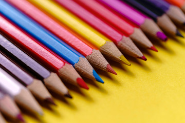 Color Pencils on yellow background. Colored Pencils Background. Crayons Close Up. - Image