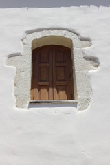 Window in stone wall, Greece, Crete