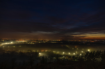 City lights in the fog