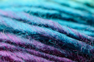 Close-up of soft fuzzy turquoise and purple yarn