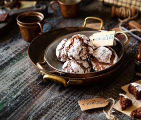 chocolate christmas crinkle cookies in copper plates