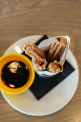 Cinnamon sugar caramel churros with chocolate dipping sauce 