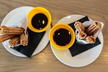 Cinnamon sugar caramel churros with chocolate dipping sauce 