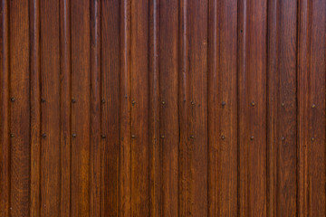 Obraz premium generic background of a wooden vertical plank wall with screws and nerfs