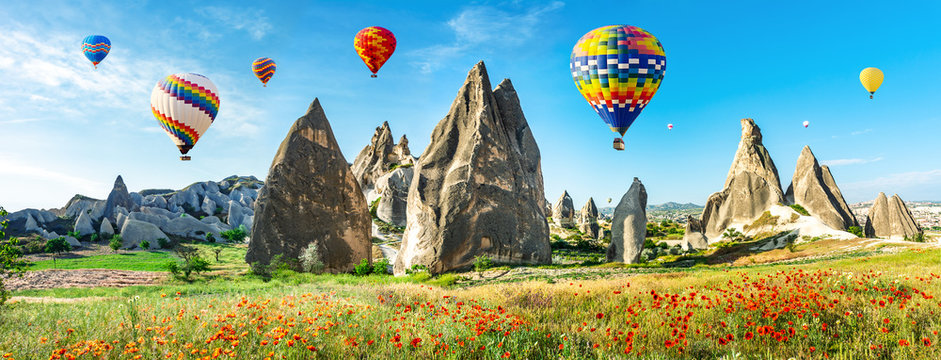 Travel concept. The great tourist attraction of Cappadocia - balloon flight. Cappadocia is known around the world as one of the best places to fly with hot air balloons. Goreme, Cappadocia, Turkey. Ar