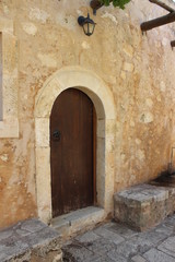 Fototapeta na wymiar Old door in Arkadi Monastery Rethymnon, Crete, Greece