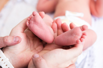 Fototapeta na wymiar feet of newborn baby