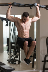 Fototapeta na wymiar Bodybuilder Doing Pull Ups Best Back Exercises
