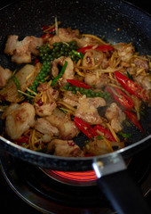 The ingredients stir-frying in the cooking pan