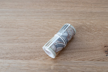 Polish banknotes lay on the table. Polish currency on a wooden background. 200 Polish zlotys.