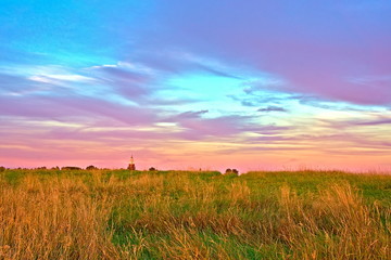 Summer sunset over the field. Kostroma region, Russia.