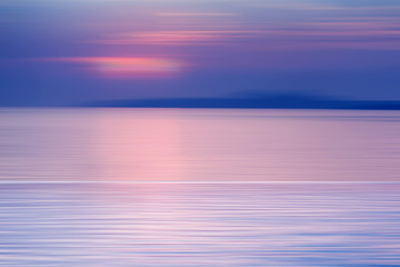 Motion blurred background of refraction in water