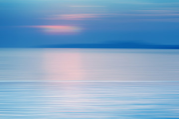 Motion blurred background of refraction in water