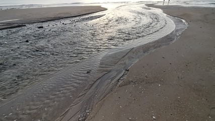 Beautiful dawn, morning sun rises by the sea. Scenic beach, sea, ocean, coastline, rocks, sands, cloudscape and skyline photography.