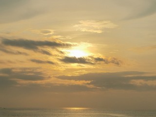 Beautiful dawn, morning sun rises by the sea. Scenic beach, sea, ocean, coastline, rocks, sands, cloudscape and skyline photography.