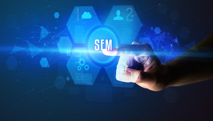 Hand touching SEM inscription, new technology concept