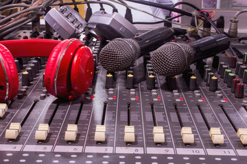Wireless microphone on a professional audio mixer.