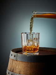 whiskey pouring into glass