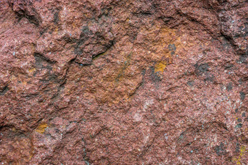 Details of texture of Baltic red porphyry rock in Poland