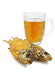 Glass beer mug and two smoked bream isolated on white background