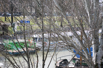 boats docked on the river side, river Bega in Timisoara