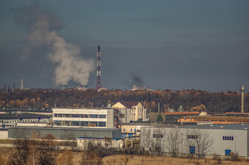 Fototapeta na wymiar Factories in an industrial area among the forest