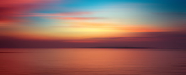 Motion blurred background of sunset on the sea