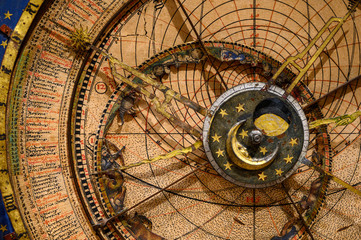 Fototapeta na wymiar an ancient clock with constellations