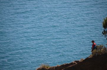 Fototapeta na wymiar Single man facing the sea