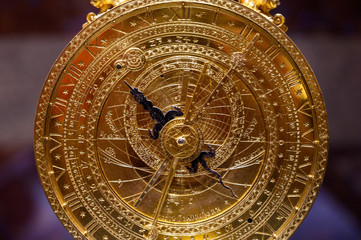 an ancient clock with constellations	