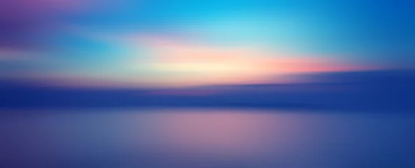 Foto op Aluminium Beweging wazige achtergrond van zonsondergang op de zee © opasstudio