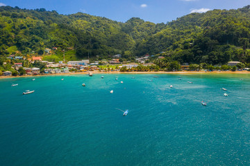 Aeria lview of the Tobago island from above. Blue Caribbean sea with huge waves by the beach.