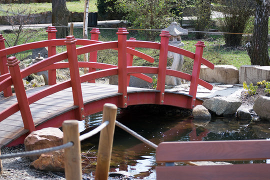 wooden bridge over a small pond in the park in timisoara romania