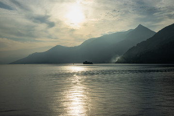 Scenic view of the Lake Maggiore at sunset on ferry boat cruising from Cannobio to Cannero Riviera, Piedmont, Italy