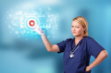 Doctor touching hologram screen displaying medical symbols and charts