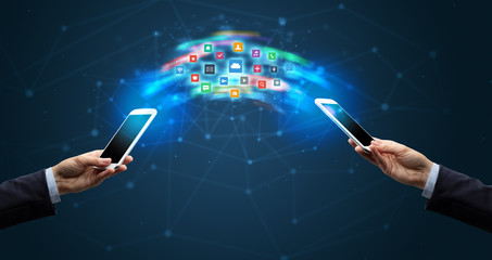 Two mobile phones syncing applications concept