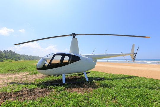 White helicopter on the beach