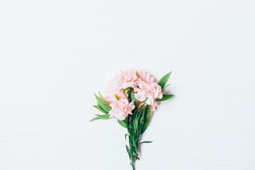 Naklejka na ściany i meble Small bouquet of beautiful pale pink carnations flowers