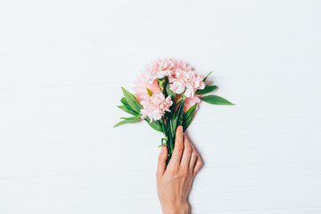 Woman's hand holding beautiful bouquet
