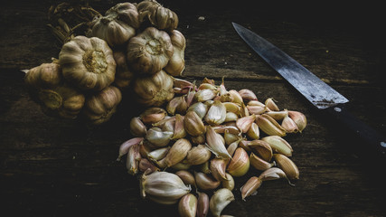 Garlic on black wood background 