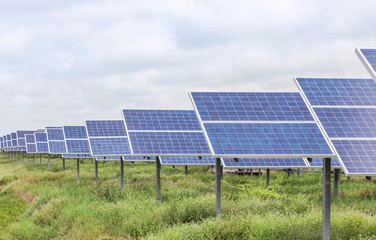 rows array of Solar panels or solar cells or photovoltaics in solar power station is power production technology renewable green clean energy energy efficiency from the sun