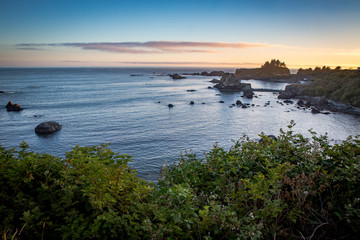 sunset over the sea on a rocky coast